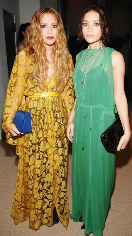 Mary-Kate Olsen and Ashley Olsen in yellow and green dresses