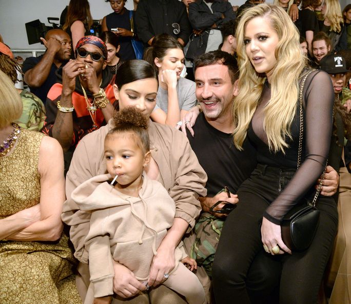 किम Kardashian, North West, Ricardo Tisci, and Khloe Kardashian at Yeezy 2 front row