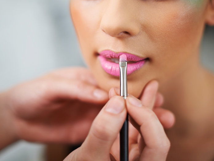 आदर्श having lipstick applied 
