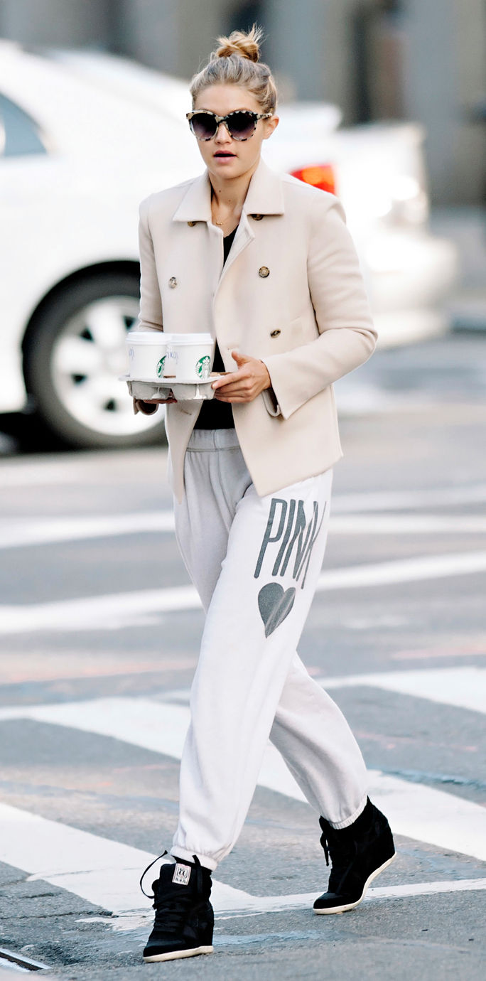 गीगी Hadid seen wearing white blazer and sweatpants while making a coffee run in NYC